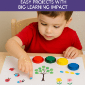 Preschool child making fingerprint art with red, green, yellow, and blue stamp pads on a tree-themed craft
