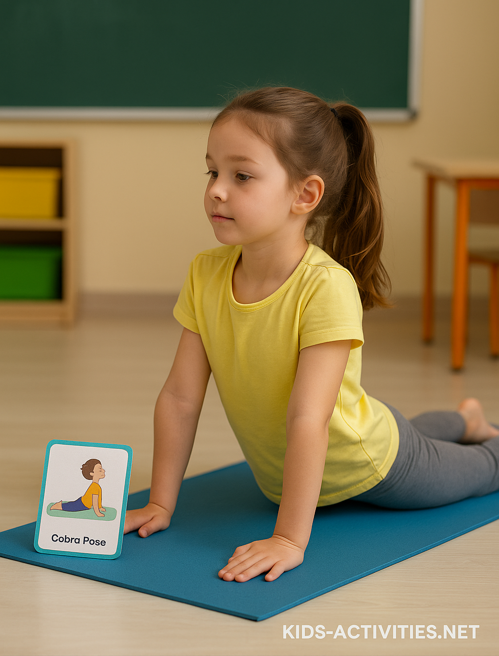 Yoga Cards for Kids’ Breaks - Kids Activities Young girl practicing Cobra Pose with a yoga card on a mat during classroom break