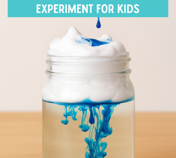 Rain in a Jar science experiment showing blue colored water dripping through shaving cream into a clear jar of water